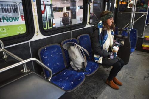 Sioux Falls - Woman Sitting on Bus Seat