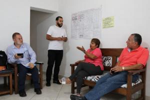 Members of a trust network in Medellin discuss a loan through the city's Bancuadra program.