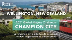 Photo of Wellington’s skyline. A blue box signifies the city as a 2021 Global Mayors Challenge Champion City with a brief description that reads: “Revolutionizing resident engagement toward climate action”