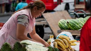 A fruit seller at a market in Bogota, Colombia