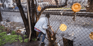 A member of the RealFix program team out in the city of Paterson, looking for residents they can aid with accessing opioid-abuse disorder treatment options available to them through RealFix.