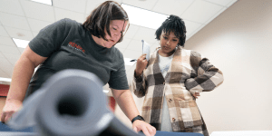 Diamond Harriel, an Equity in the Built Environment program participant, works with instructor Peggy Buehler as part of the program's Trades Readiness training at Rochester Community and Technical College.