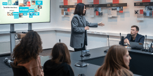 Students listening to a very animated lecturer.