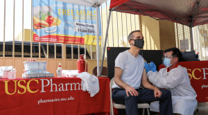 Los Angeles Mayor Eric Garcetti gets a flu shot as a part of a program providing free flu shots to city residents.