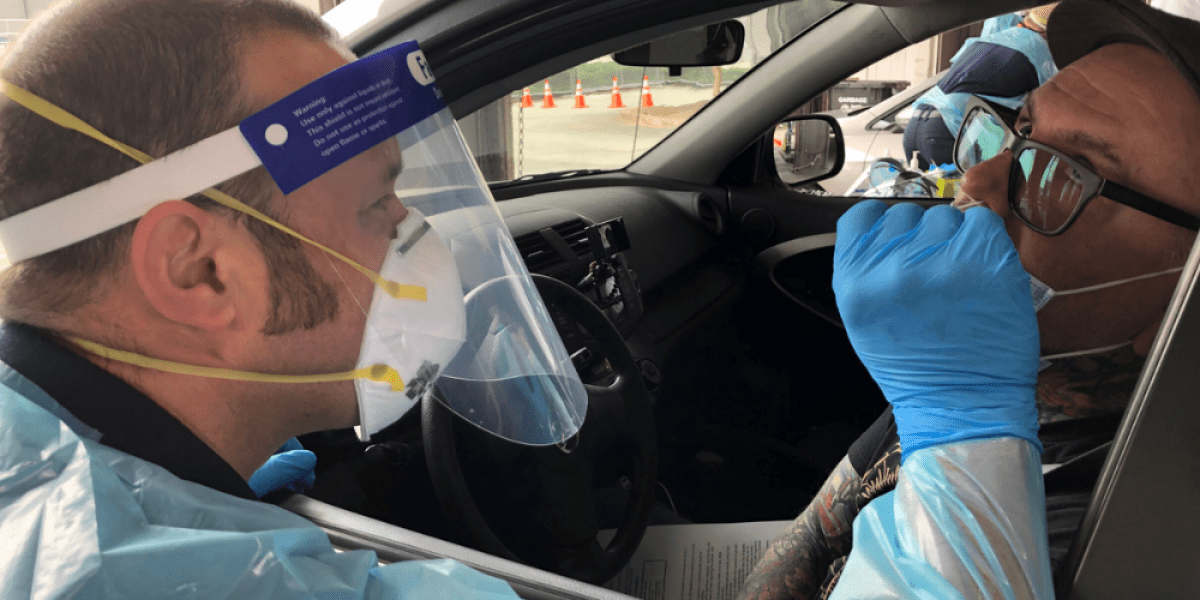 A picture of a resident receiving a COVID-19 test in Seattle.