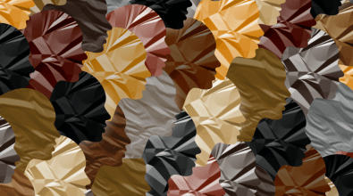 A collection of paper faces in different shades representing different skin tones