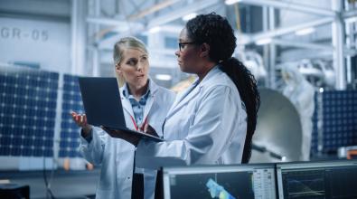 Two scientists in the lab having a conversation