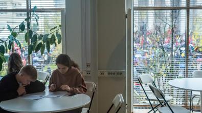 Two students working quietly at a table.