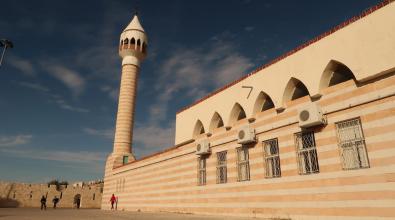 Kids playing in front of Haj Hamdi Mosque Alanis in As-Salt, Salt, Jordan.