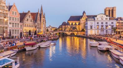 Belgium, Ghent, old town, Korenlei and Graslei, historical houses at River Leie at dusk.