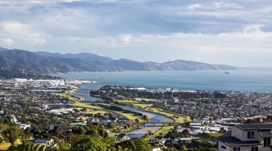 A view of Hutt river and Wellington harbour against blue sky, looking south from Hutt valley, Wellington, NZ.